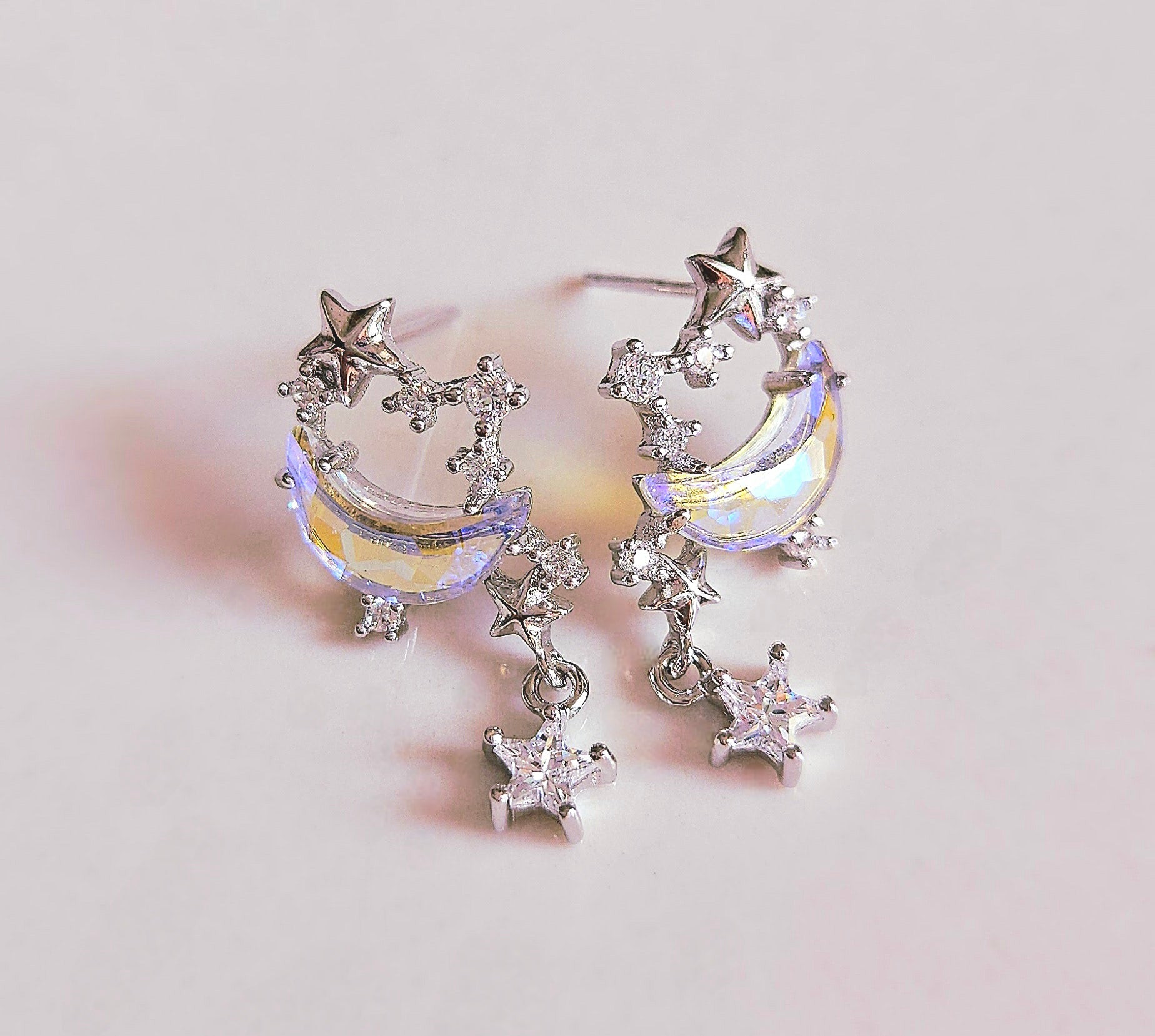 PLATINUM STARS EARRINGS WITH COLOUR-CHANGING CUBIC ZIRCONIA MOON