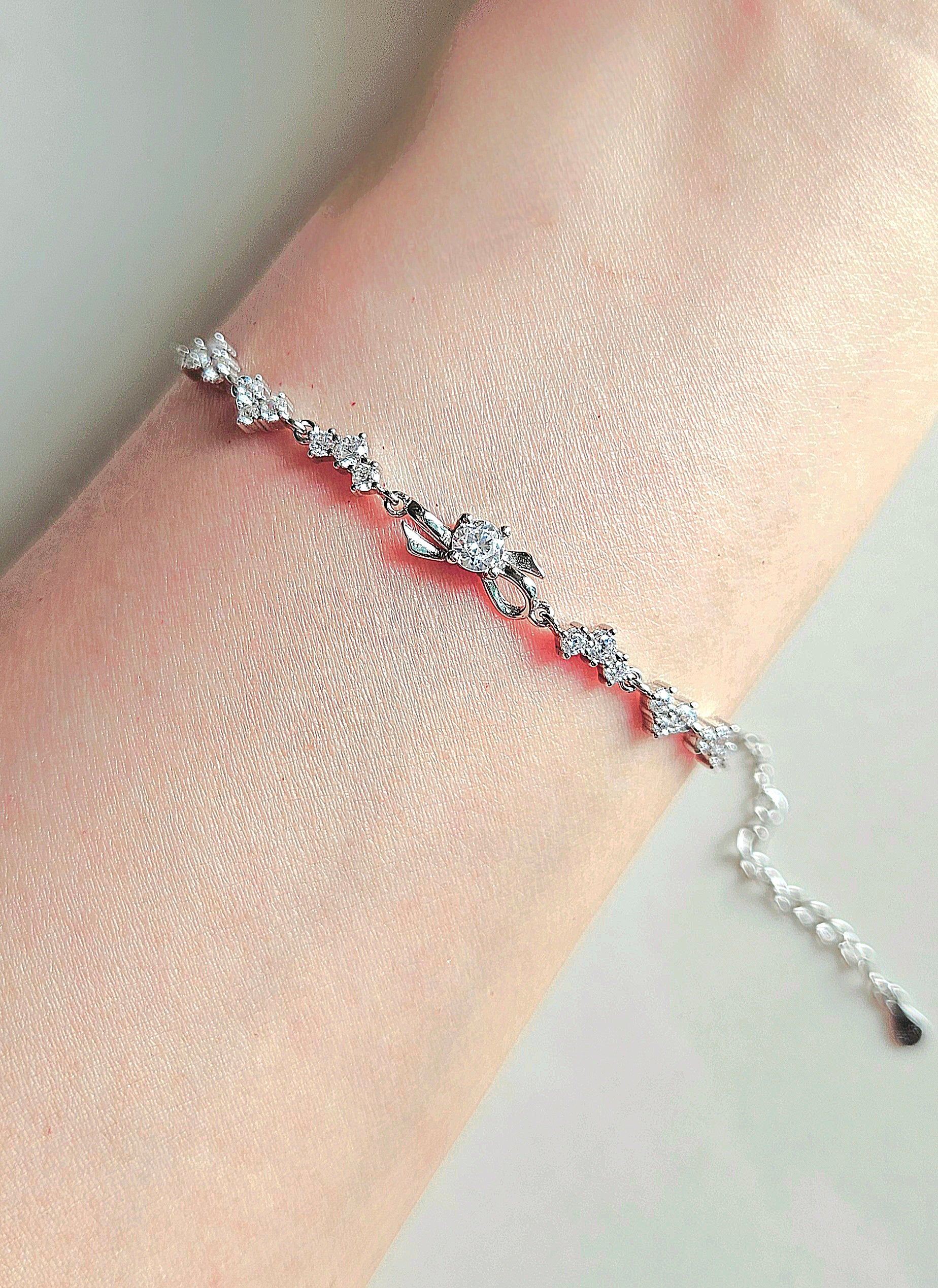 925 STERLING SILVER BOW BRACELET CRUSTED WITH CUBIC ZIRCONIA STONES