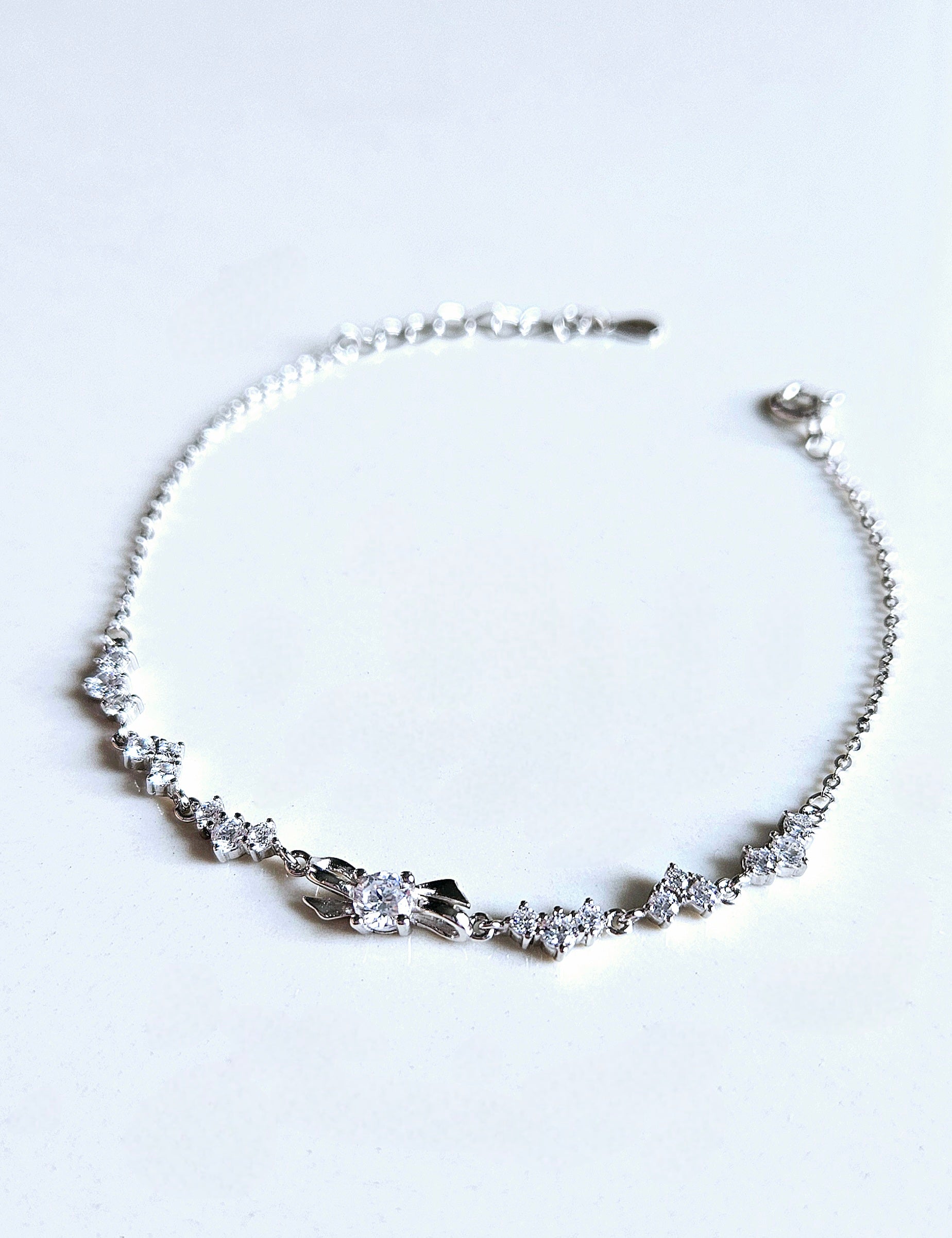 925 STERLING SILVER BOW BRACELET CRUSTED WITH CUBIC ZIRCONIA STONES