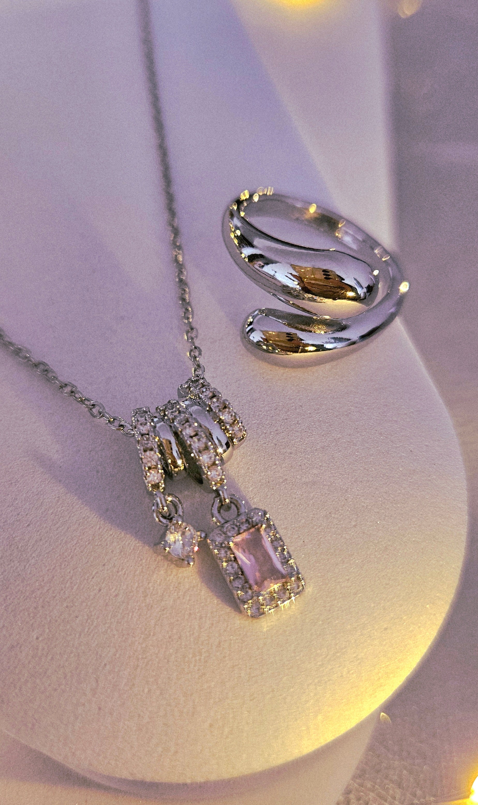 STAINLESS STEEL NECKLACE WITH PINK CUBIC ZIRCONIA PENDANT