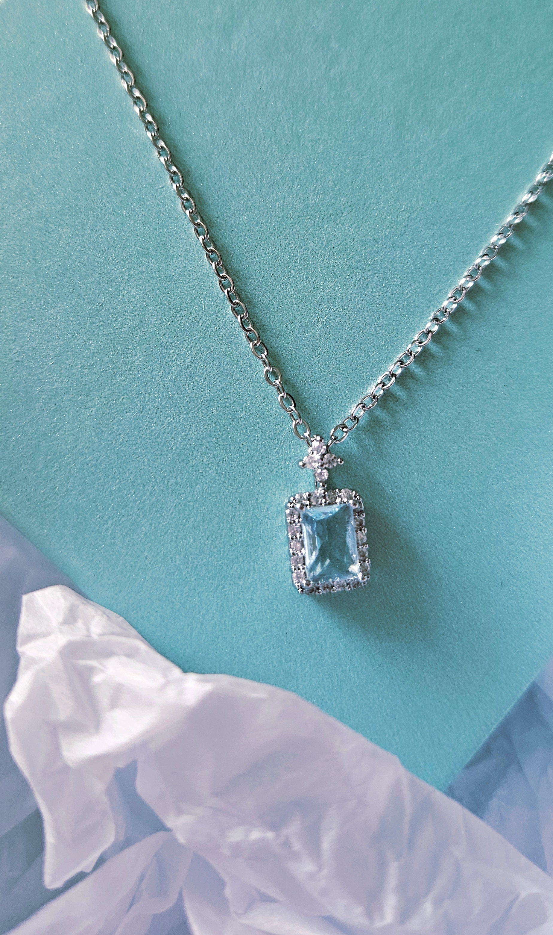 STAINLESS STEEL NECKLACE WITH AQUA CUBIC ZIRCONIA PENDANT