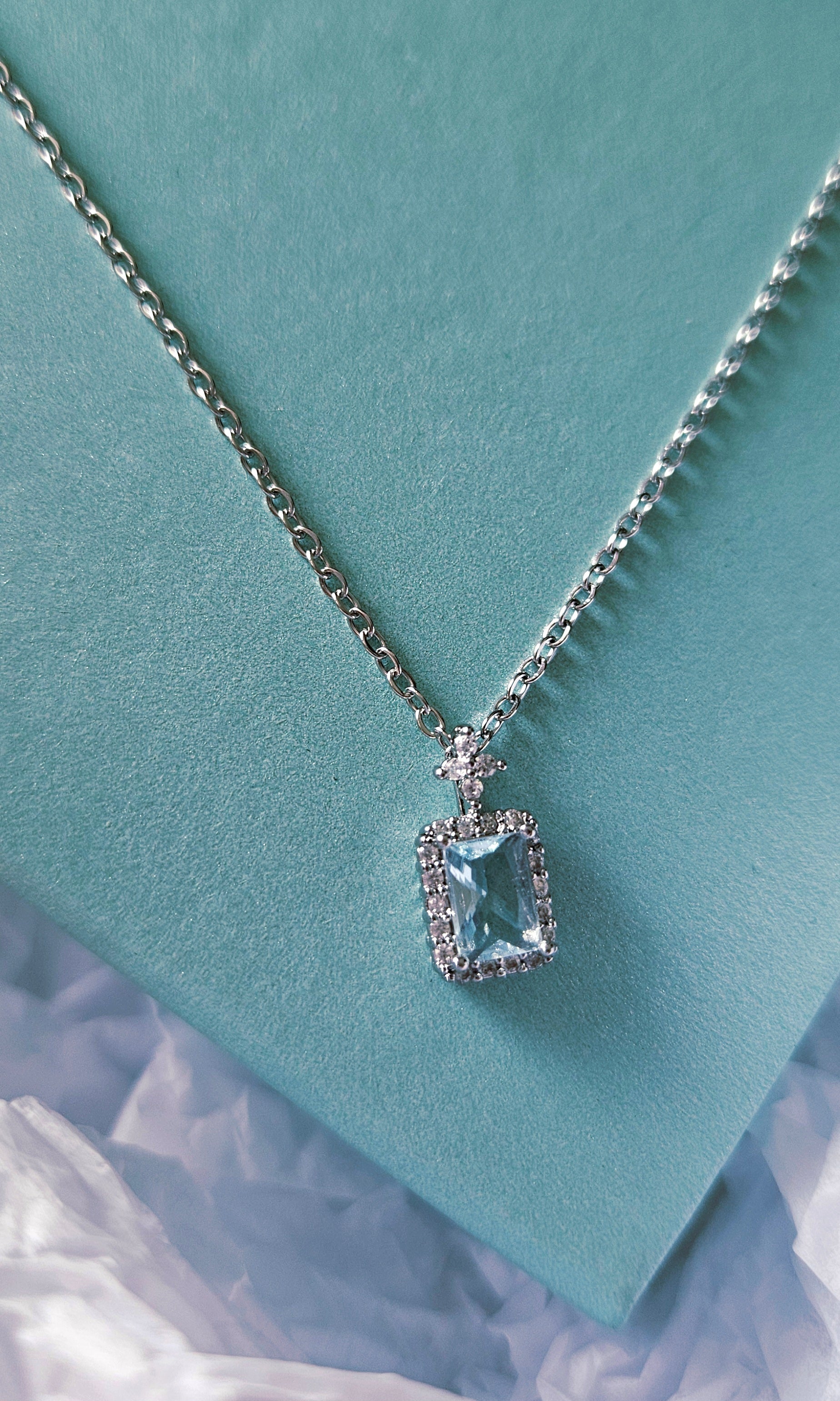 STAINLESS STEEL NECKLACE WITH AQUA CUBIC ZIRCONIA PENDANT