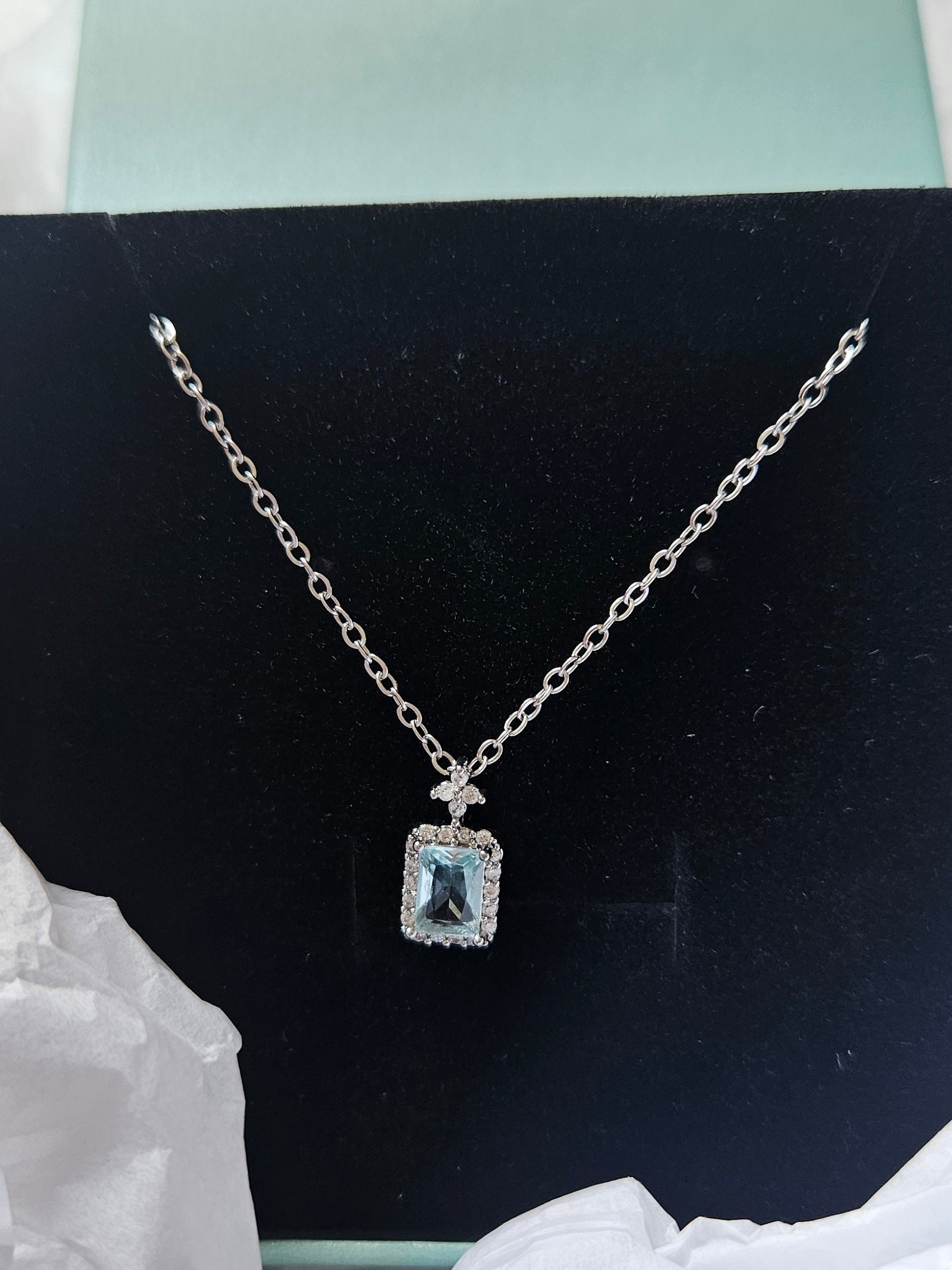 STAINLESS STEEL NECKLACE WITH AQUA CUBIC ZIRCONIA PENDANT