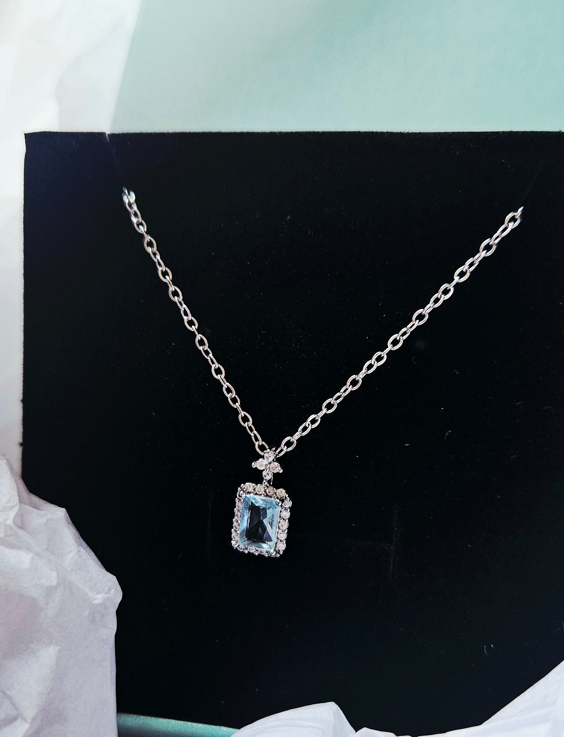 STAINLESS STEEL NECKLACE WITH AQUA CUBIC ZIRCONIA PENDANT