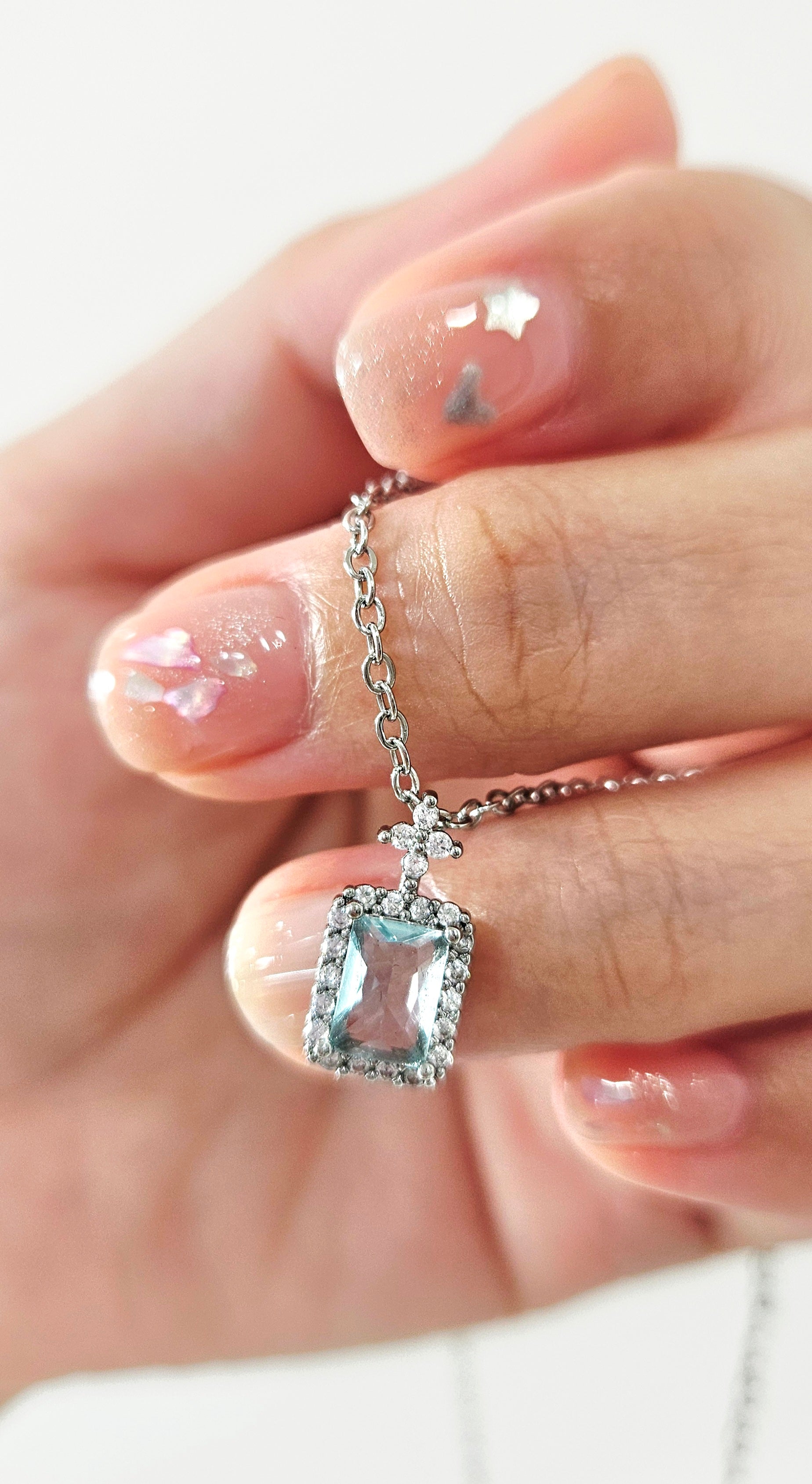 STAINLESS STEEL NECKLACE WITH AQUA CUBIC ZIRCONIA PENDANT