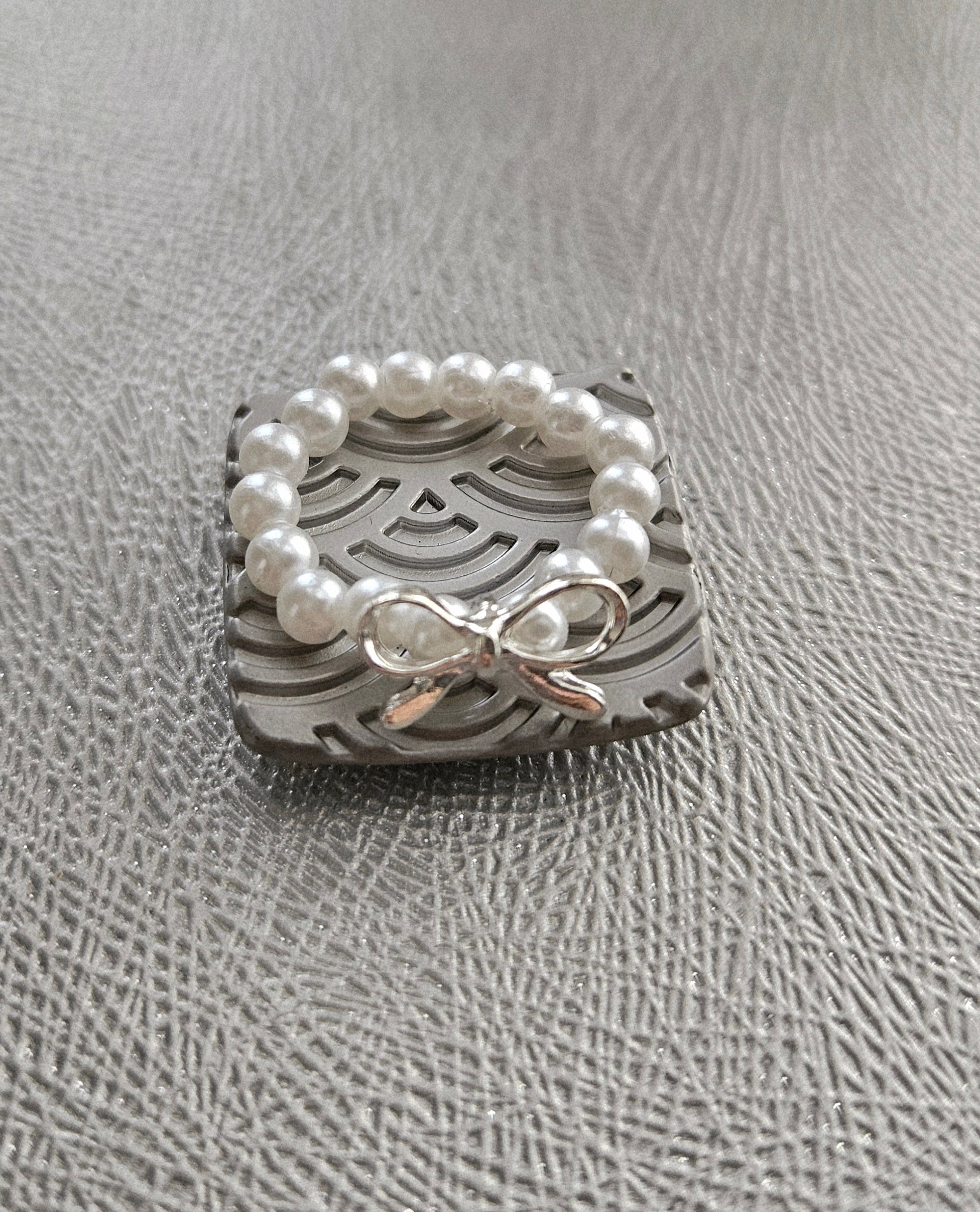 SET OF 2 SILVER BRACELETS & A FAUX PEARL BOW RING