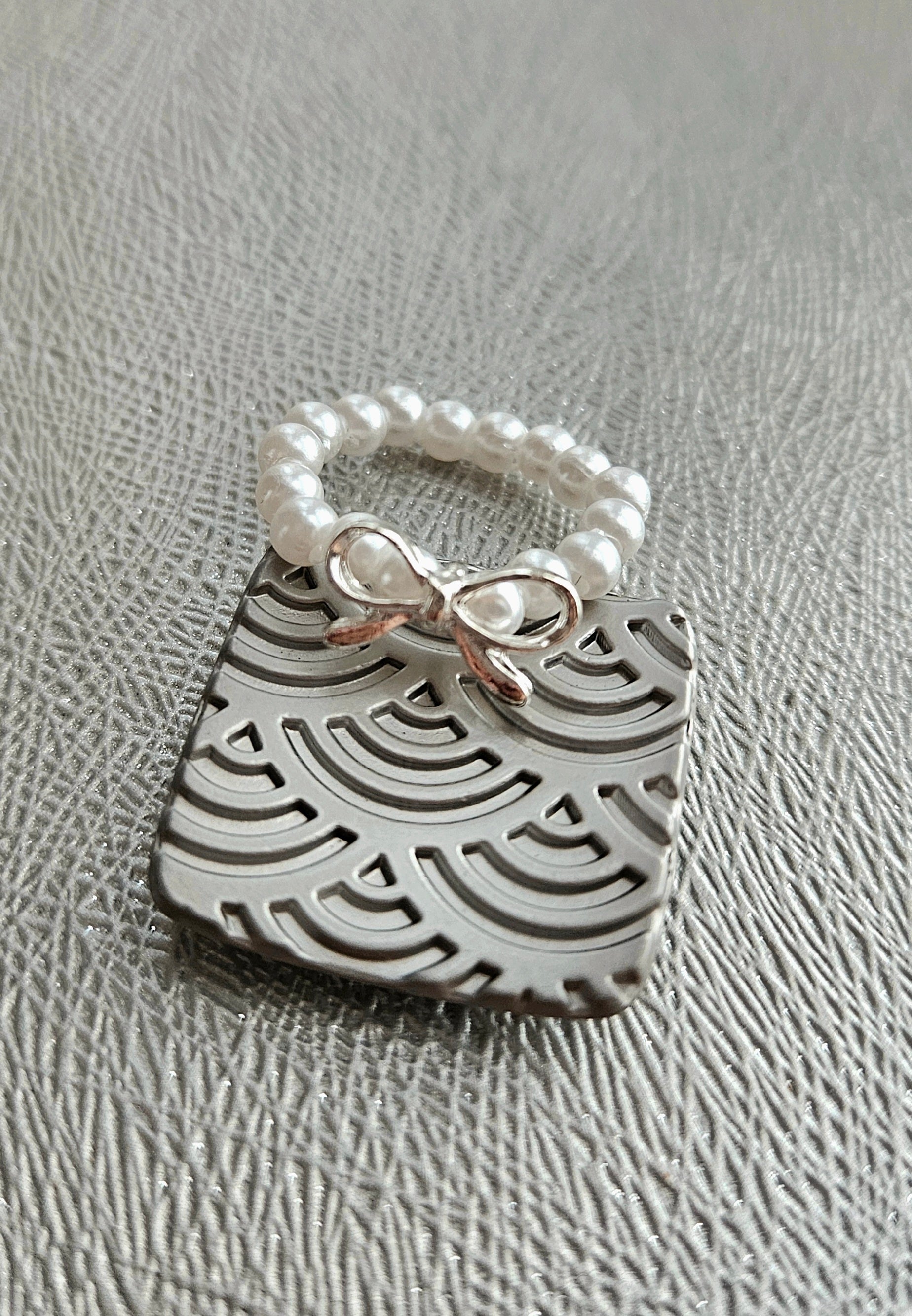 SET OF 2 SILVER BRACELETS & A FAUX PEARL BOW RING