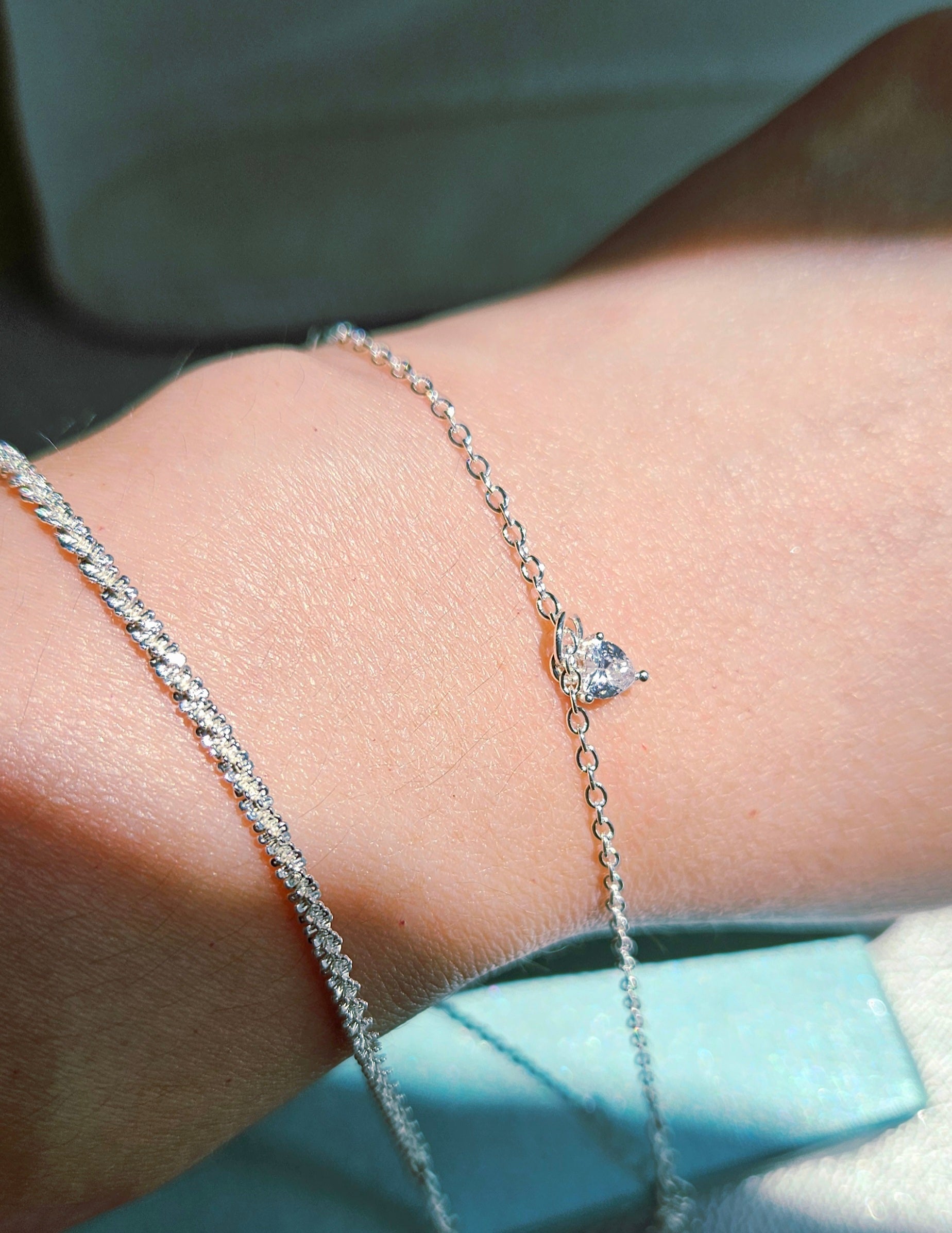 SET OF 2 SILVER BRACELETS & A FAUX PEARL BOW RING