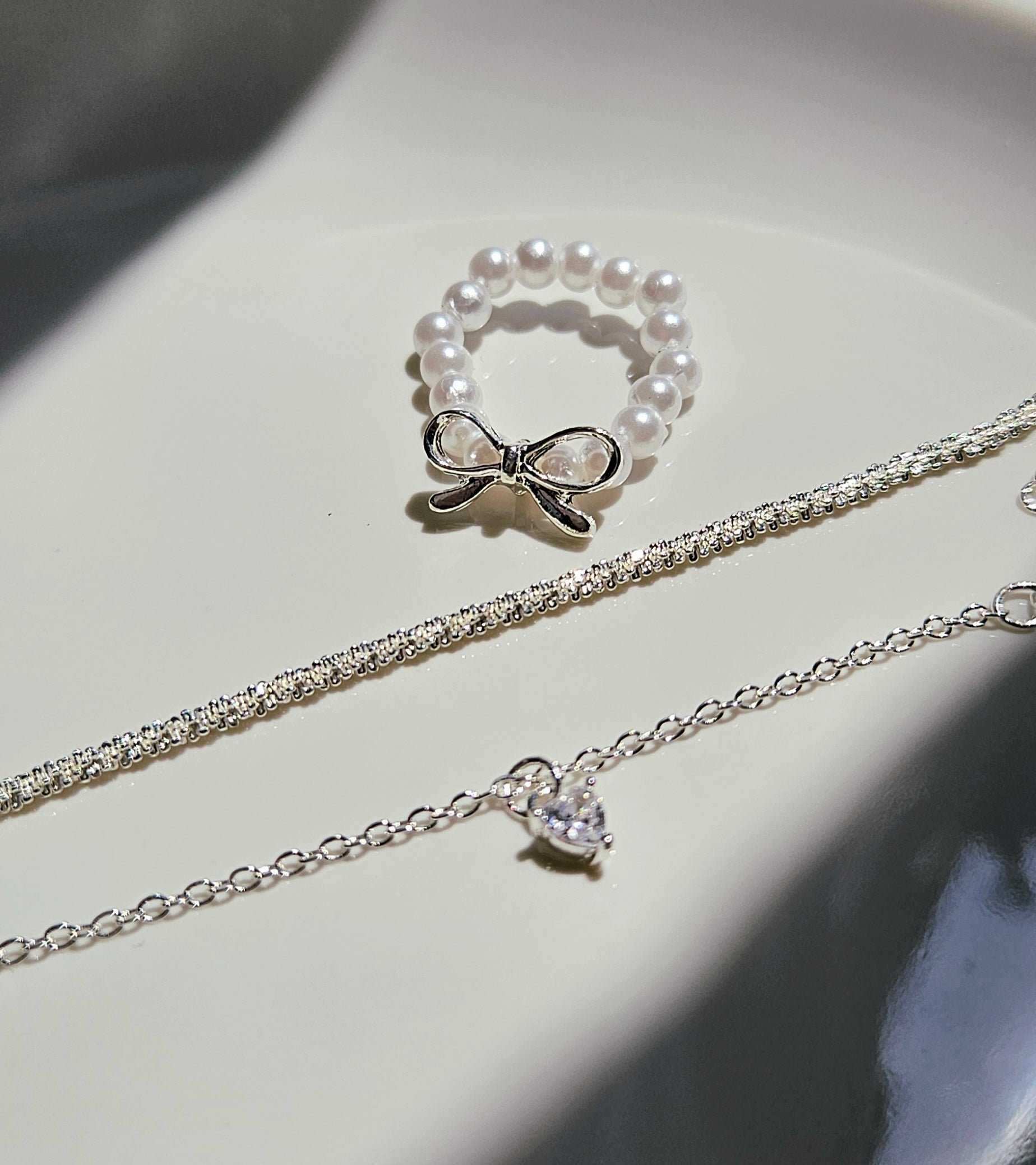 SET OF 2 SILVER BRACELETS & A FAUX PEARL BOW RING