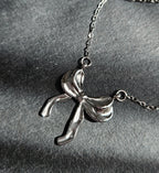 STAINLESS STEEL SILVER BOW EARRINGS AND NECKLACE SET