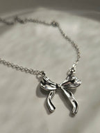 STAINLESS STEEL SILVER BOW EARRINGS AND NECKLACE SET