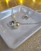 STAINLESS STEEL SILVER NECKLACE WITH FAUX PEARL AND SHELL PENDANT