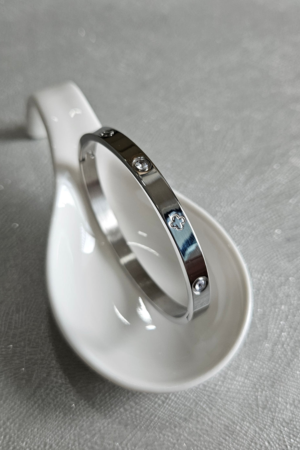 STAINLESS STEEL SILVER CLOVER BANGLE WITH RHINESTONES