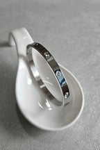 STAINLESS STEEL SILVER CLOVER BANGLE WITH RHINESTONES